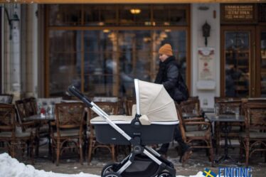 a pram parked outside a cafe in sweden