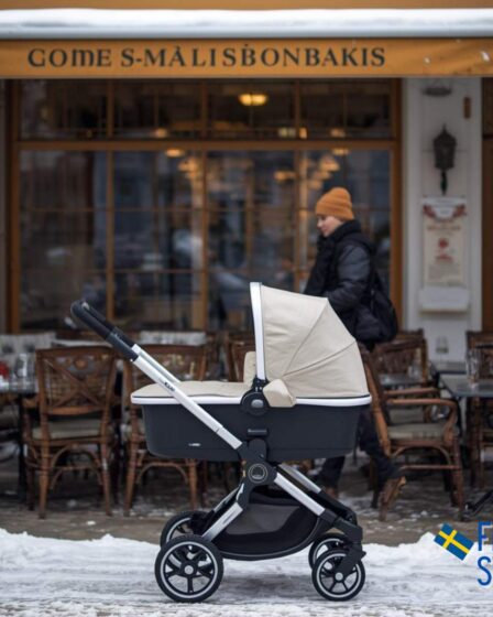 a pram parked outside a cafe in sweden