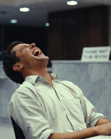 A man laughing in a bank in Sweden