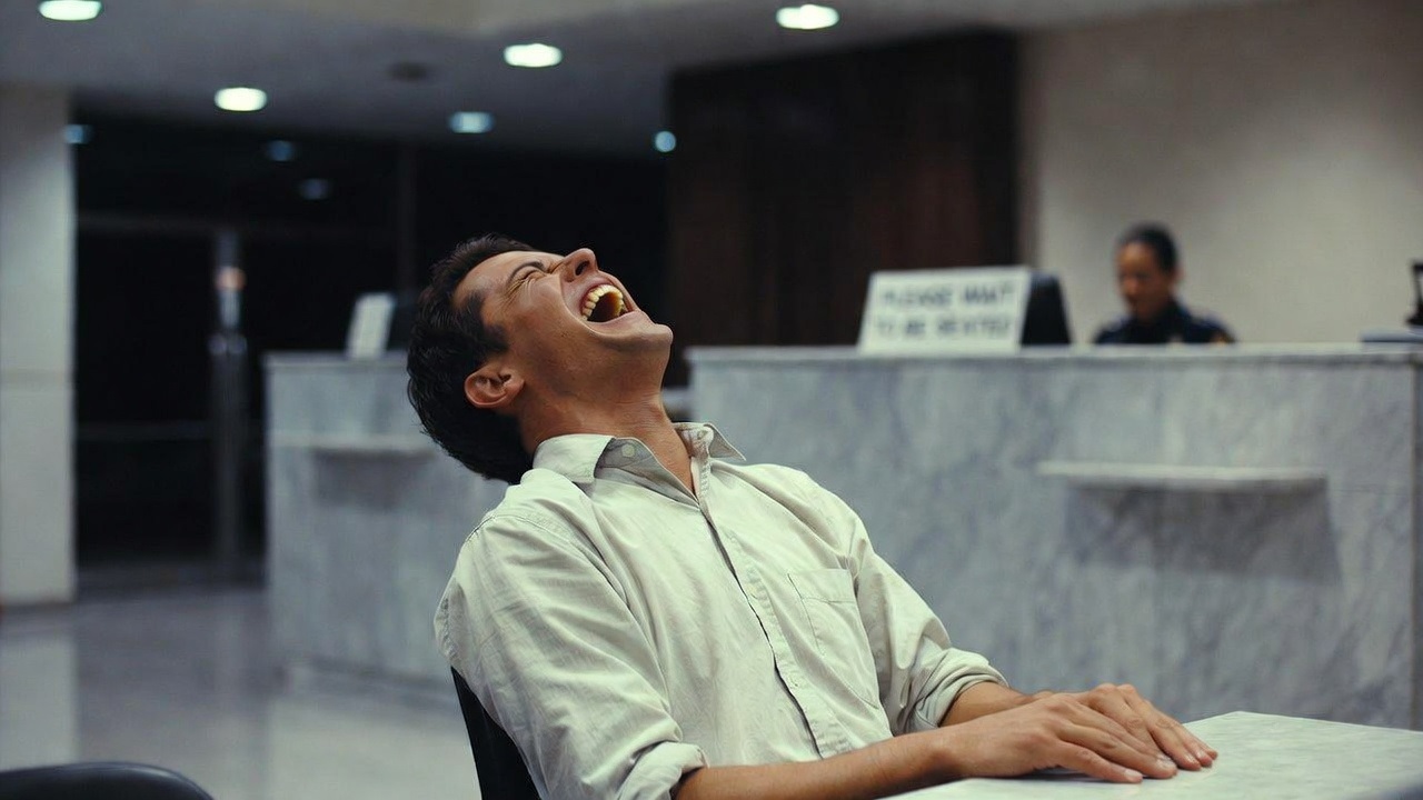 A man laughing in a bank in Sweden